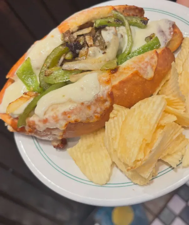 Cheese steak sandwich with chips